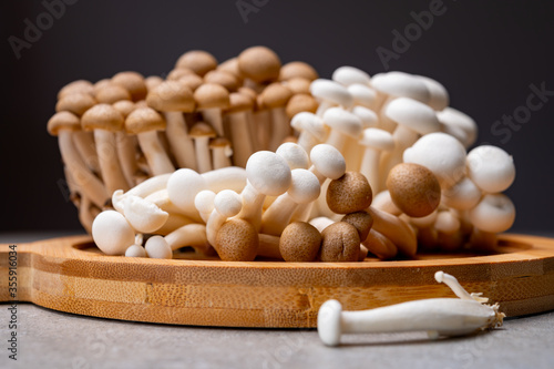 Fresh buna brown and bunapi white shimeji edible mushrooms from Asia, rich in umami tasting compounds such as guanylic and glutamic acid photo