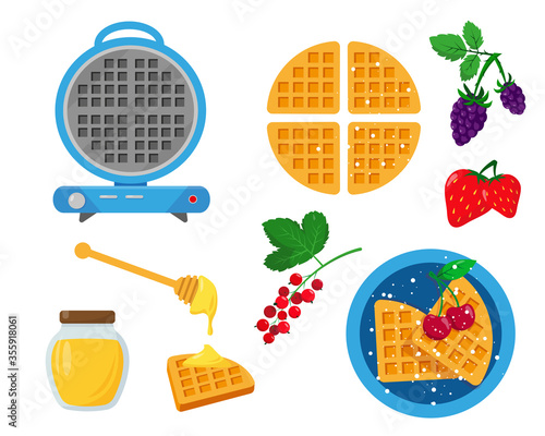 Blue waffle maker with waffles, berries and honey