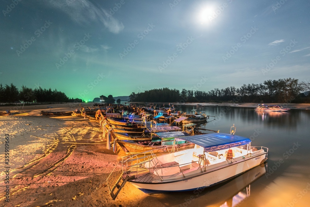 Thai boats on Andaman Sea at night in Krabi Thailand Asia