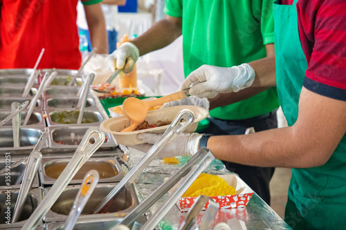 young man preparing food in the food stall