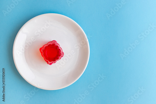 Strawberry jelly on a white plate
