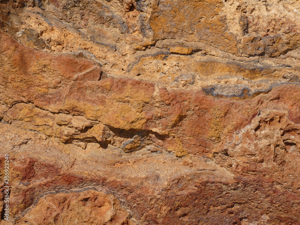 Obraz premium Close up of an ochre rock in Serra Gelada Natural Park (El Parc Natural de la Serra Gelada), El Albir, Costa Blanca, Spain 