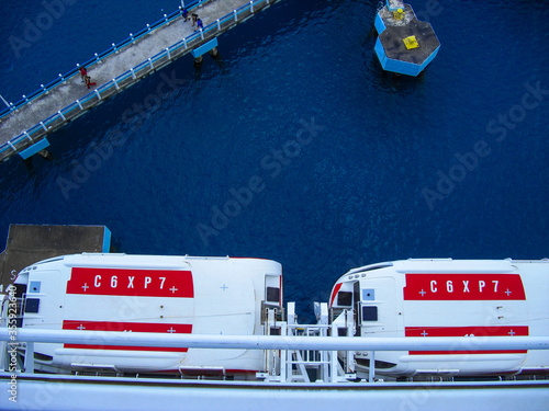 Ocho Rios, Jamaica - December 24, 2014 - Aerial view of two lifeboats of the cruise ship Norwegian Epic at the harbor of Ocho Rios, Jamaica.