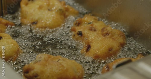 Deep frying oliebollen - a typical Dutch pastry eaten at the end of the calendar year. photo