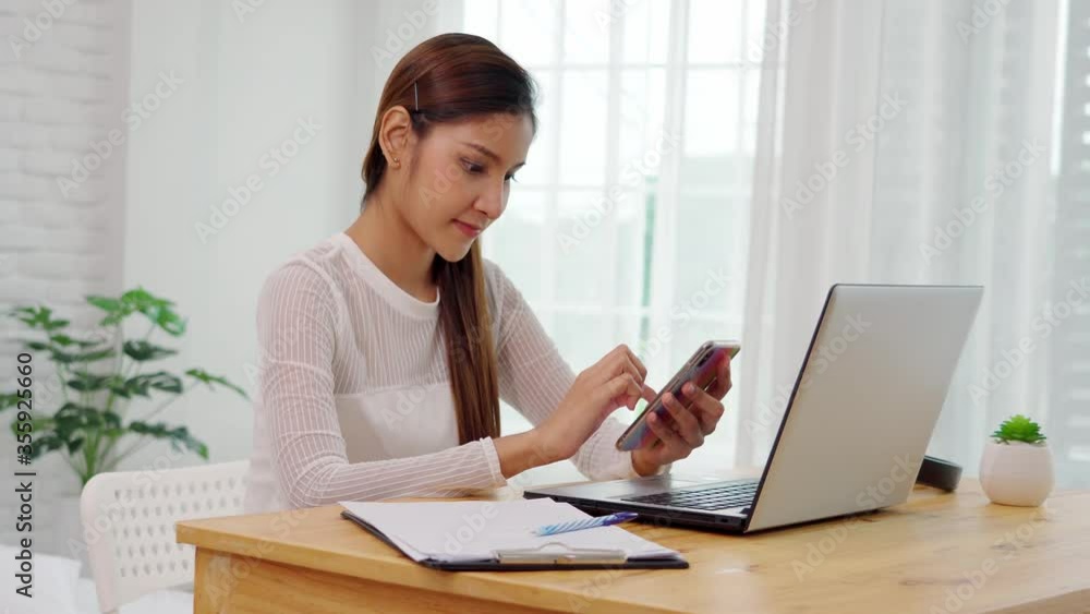 Asian business woman usie mobile phone for shopping online Asian business woman usie mobile phone for shopping online
