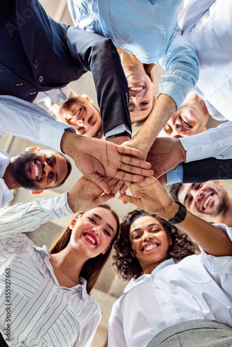 United Business Team Of Colleagues Holding Hands, Bottom View