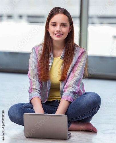 Young girl surfing internet on laptop Free Download Young girl surfing internet on laptop - GFXLoad