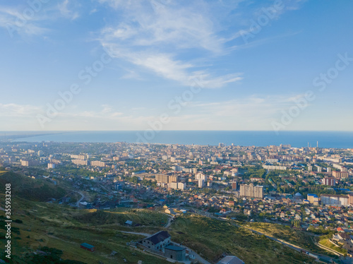 Landscape made from the mountain of Makhachkala city in Russia with a clear blue sky above the ocean. 