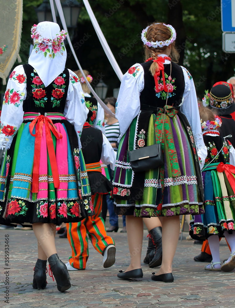 People in traditional folk costume from Lowicz region in Poland while join annual Corpus Christi procession