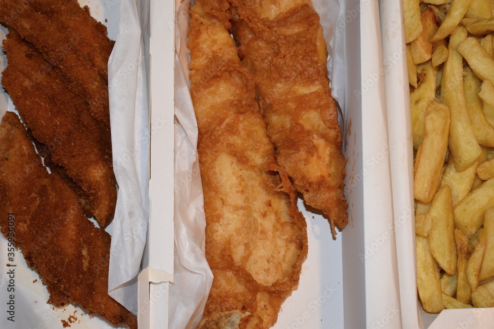 Seafood takeaway dinner for two. Large battered haddock rock in