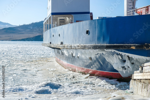 Ship stuck in frozen Lake Baikal during winter.