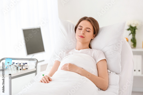 Young woman in hospital room photo