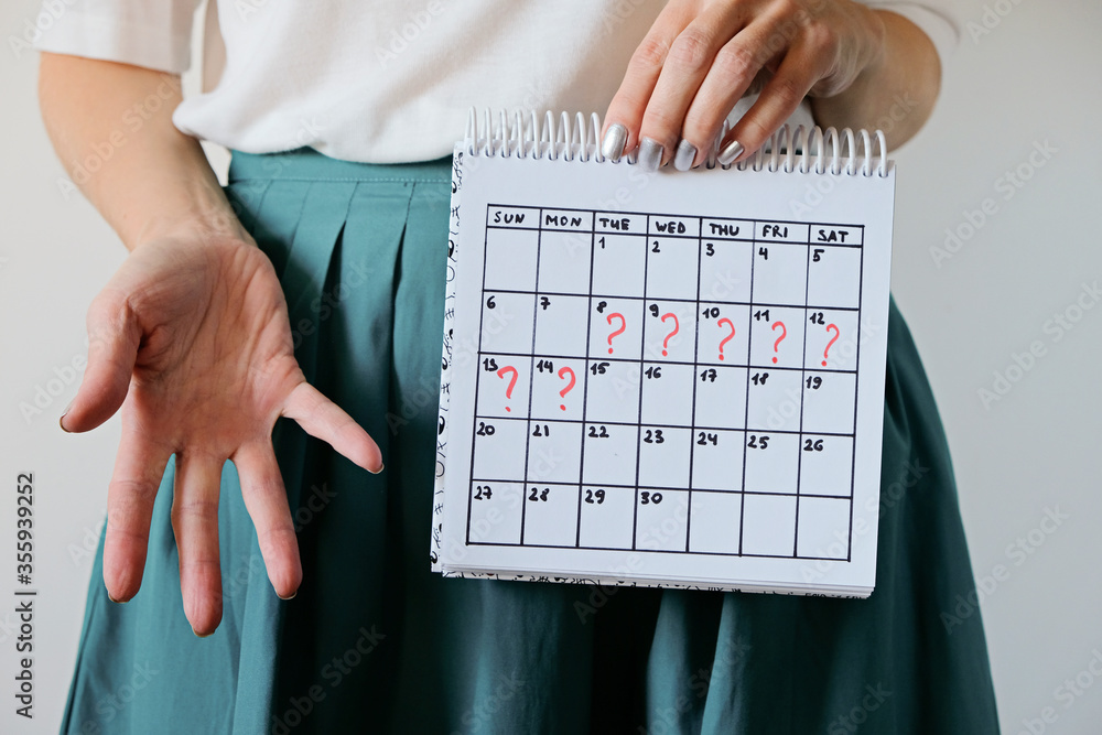Missed period and marking on calendar. Unwanted pregnancy, woman's health and delay in menstruation. - obrazy, fototapety, plakaty 