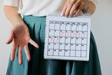 Missed period and marking on calendar. Unwanted pregnancy, woman's health and delay in menstruation.