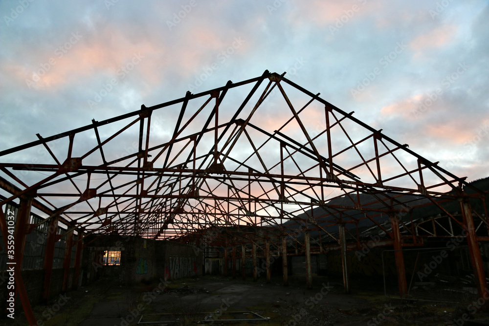 Fototapeta premium Derelict warehouse at Sunset