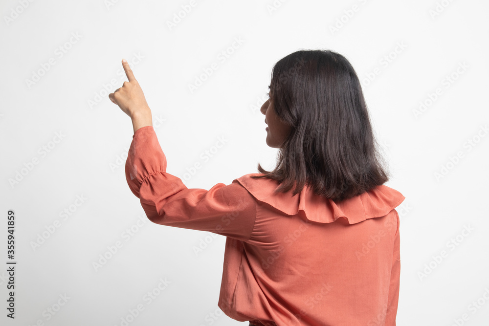 Back of Asian woman touching the screen with her finger . Back of Asian woman touching the screen with her finger .