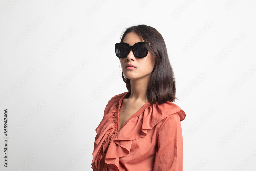 Portrait of a beautiful young asian girl in sunglasses . Portrait of a beautiful young asian girl in sunglasses .
