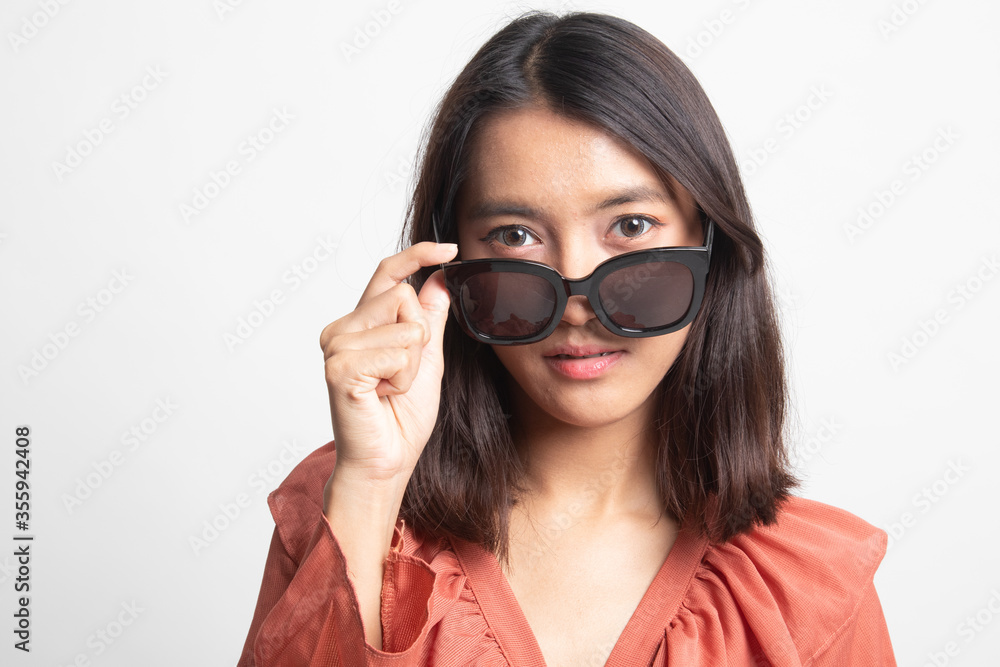 Portrait of a beautiful young asian girl in sunglasses . Portrait of a beautiful young asian girl in sunglasses .