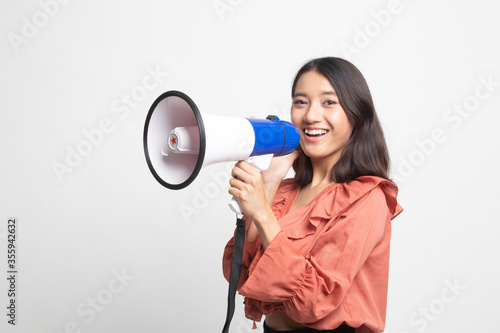 Beautiful young Asian woman announce with megaphone .
