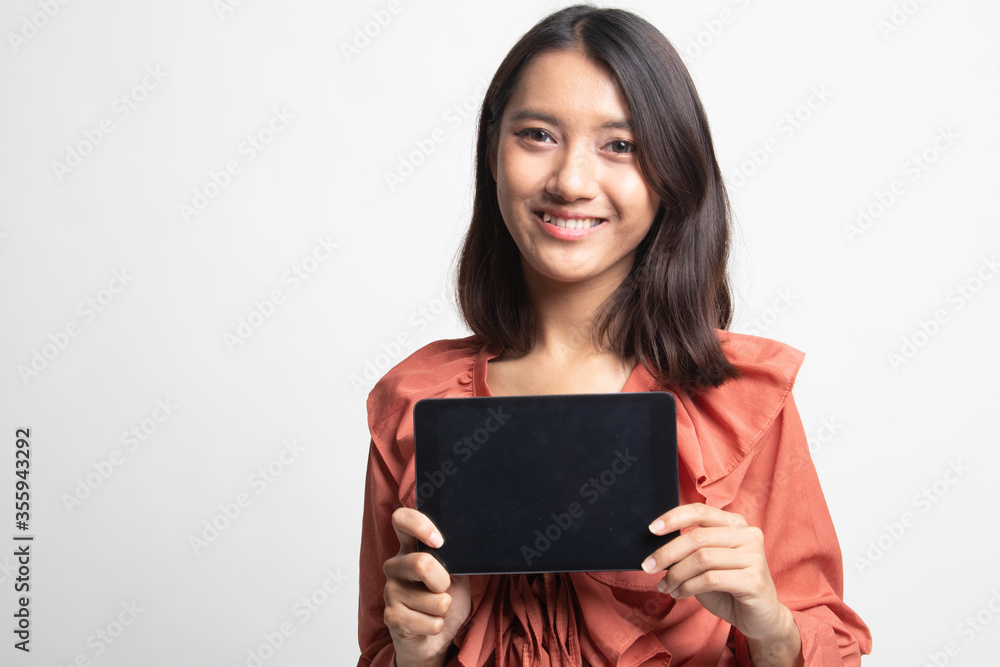 Young Asian woman with a computer tablet . Young Asian woman with a computer tablet .