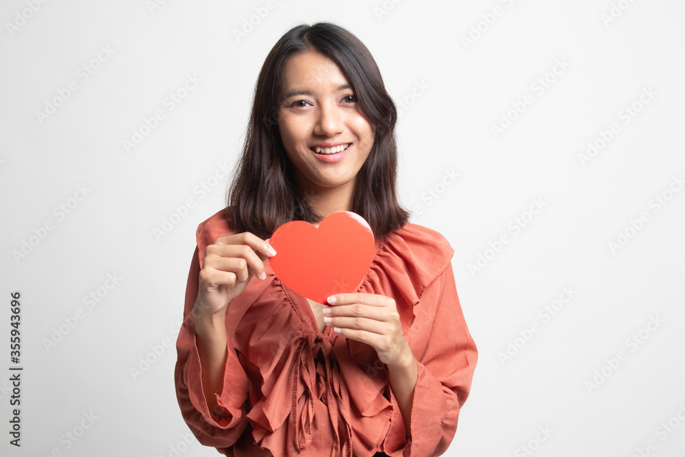 Asian woman with red heart . Asian woman with red heart .