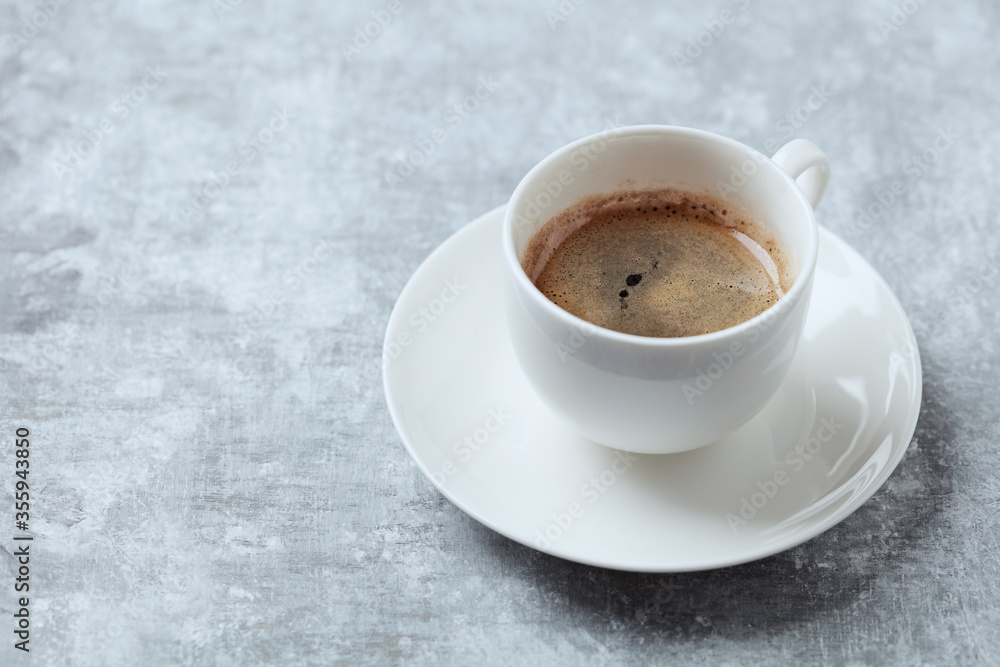Cup of coffee on bright wooden background. Copy space. Cup of coffee on bright wooden background. Copy space.