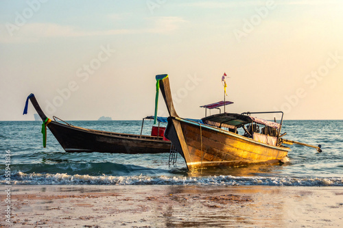 Thai traditional longtaile boats at sunset Ao Nang Beach province of Krabi Thailand.