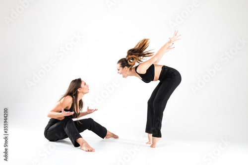 Two girls quarrel and shout at each other in dance uniforms. Feelings, expression of emotions, lifestyle, anger, anger, scream