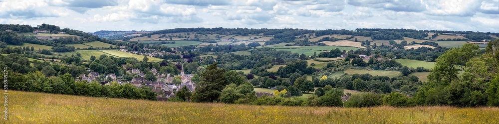 Panoramic landscape looking down on the historic village of Box, near Bath in Wiltshire, UK on 7 June 2020