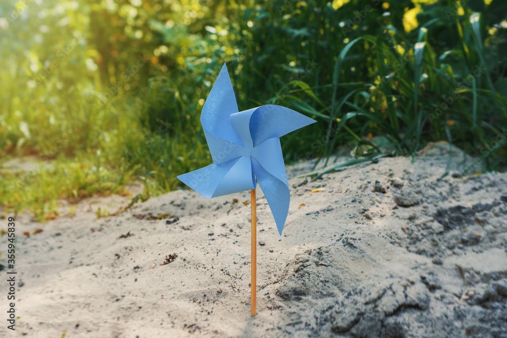 paper windmill on natural background