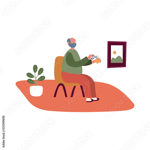 eldery cutting with scissors man in home activity free form style