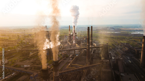 Industry metallurgical plant smoke from pipes mining ecology pollution.