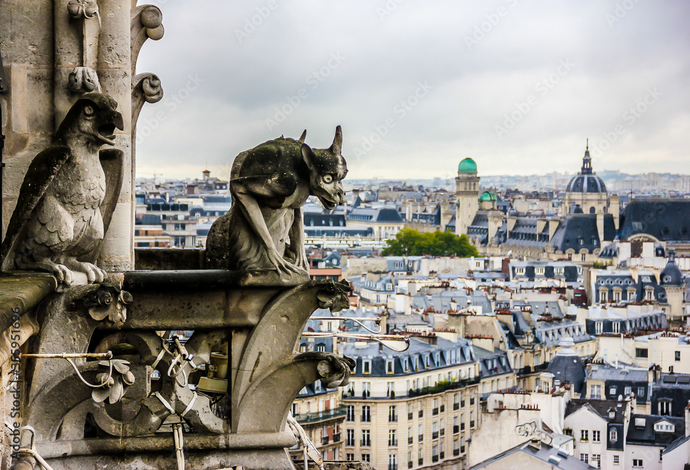 Mythical creature gargoyle on Notre Dame de Paris. View from the tower. Paris, France