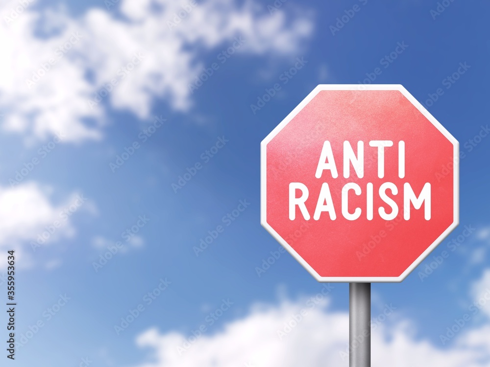 Anti-racism - Road sign on blue sky background Anti-racism - Road sign on blue sky background