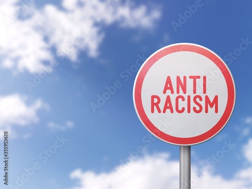 Anti-racism - Road sign on blue sky background