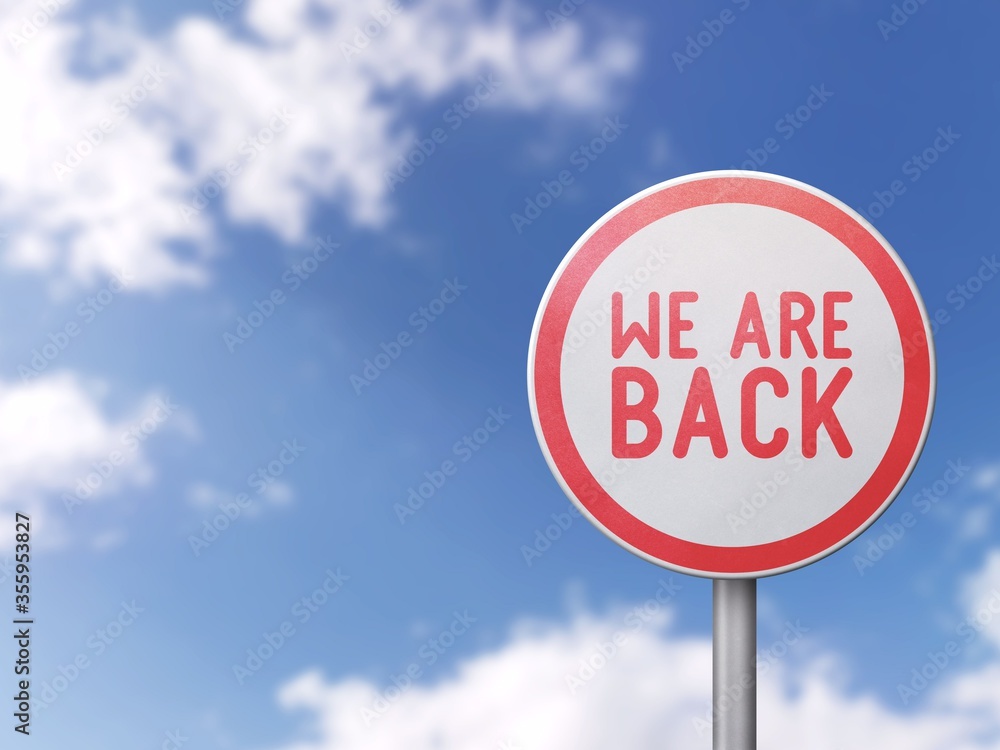 We are back - Road sign on blue sky background
