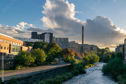 Student housing in Glasgow's West End on the banks of River Kelvin at sunset. Picturesque urban scene.