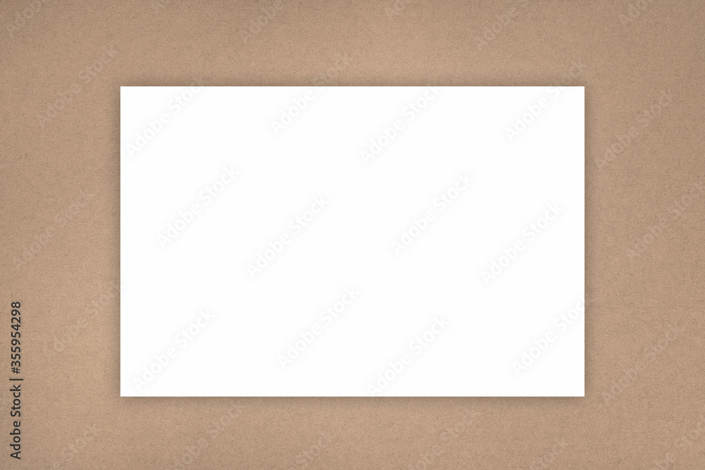 White sheet of paper on a kraft beige texture background. Nature background concept.Copy space for text. White sheet of paper on a kraft beige texture background. Nature background concept.Copy space for text.