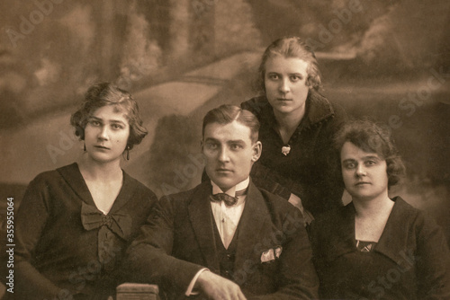 Latvia - CIRCA 1920s: Group portrait shot of three female and man in studio. Vintage Carte de Viste Art Deco era photo