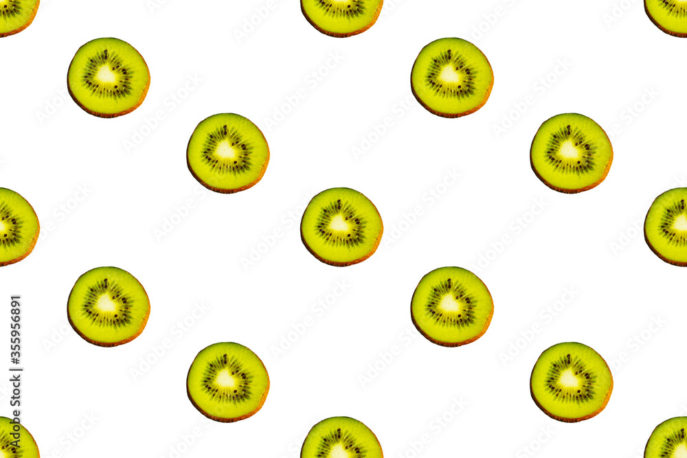Fototapeta premium Seamless endless pattern of juicy green slices of kiwi fruit isolated on white background. Design for wrapping paper, fabric and wallpaper