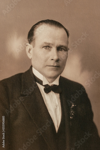 Germany - CIRCA 1920s: Man portrait close up in studio Vintage Carte de Viste art deco era photo