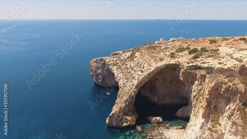 Blue Grotto in Malta. Natural arch window in rock.