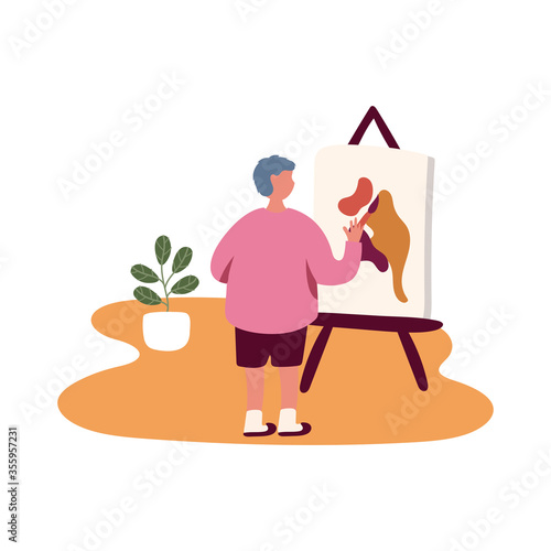 eldery man painting picture in home activity free form style