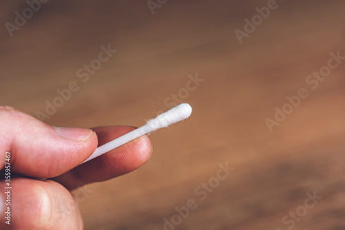 Cotton buds in woman's hand - close up
