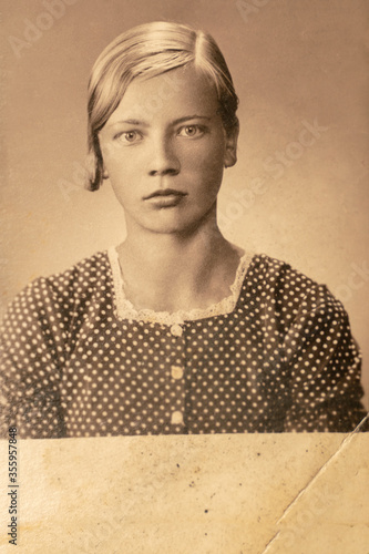 Germany - CIRCA 1930s: Portrait of young female in studio. Close up face. Vintage Art Deco era photo