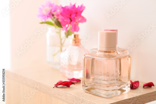 Bottles of floral perfume on table
