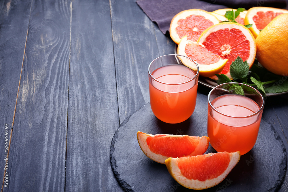 Glasses of fresh grapefruit juice on table Glasses of fresh grapefruit juice on table