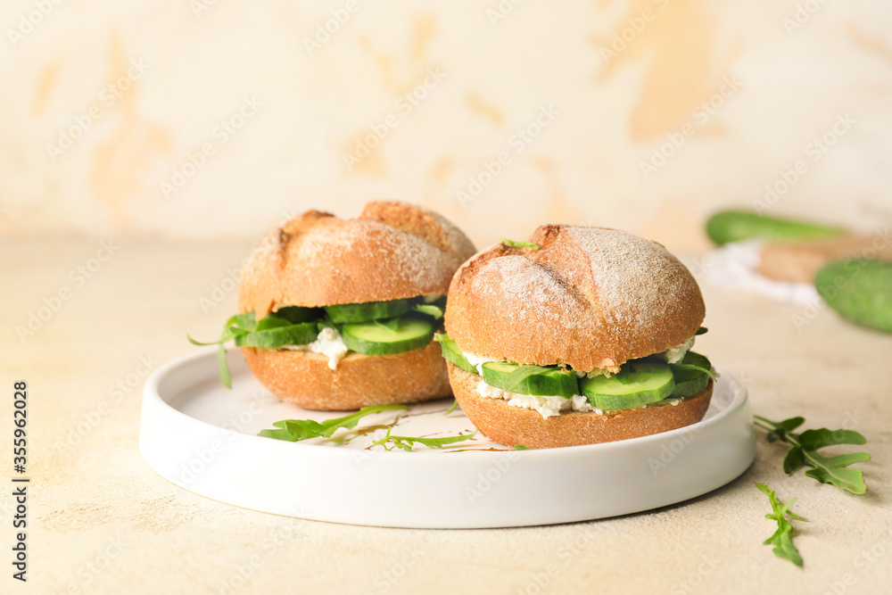Plate with tasty cucumber sandwiches on table Plate with tasty cucumber sandwiches on table