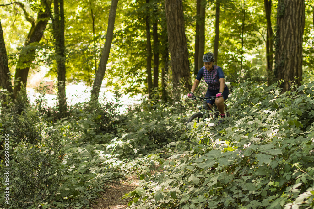 woman doing mountain biking among nature