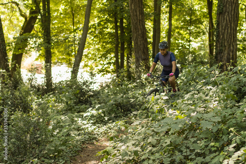 woman doing mountain biking among nature